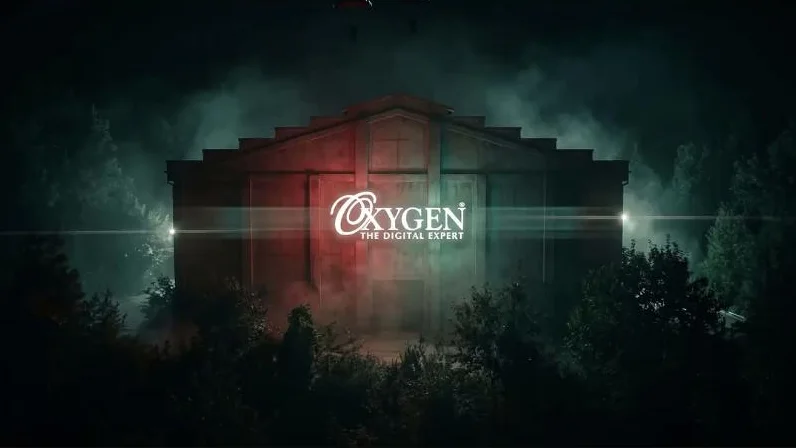 An Oxygen showroom glowing red and green in a misty forest at night